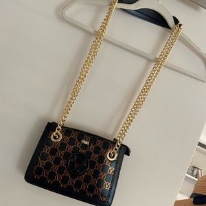 ginette magnus valentino -black/gold/bronze purse- new w tags
 8"W x 5.5"H x 2"L